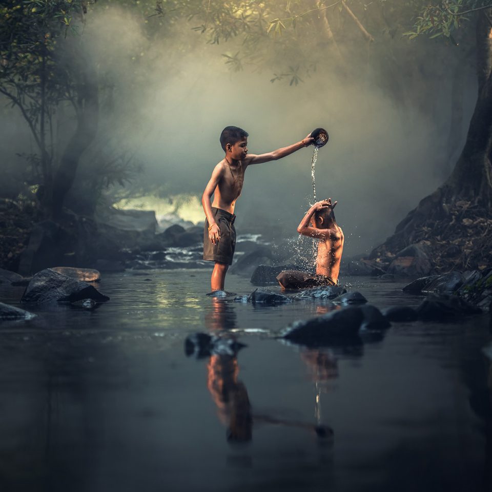 Children Playing in a River