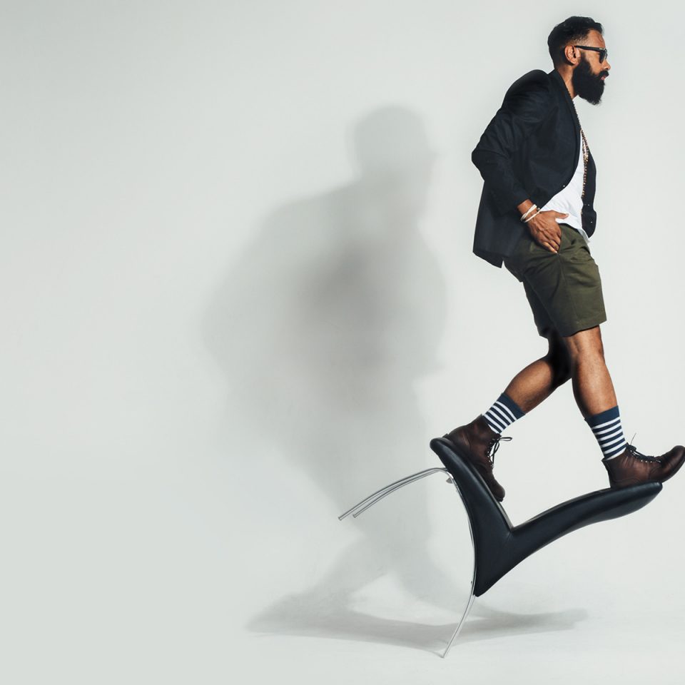 Man with a Beard Walking on a Chair